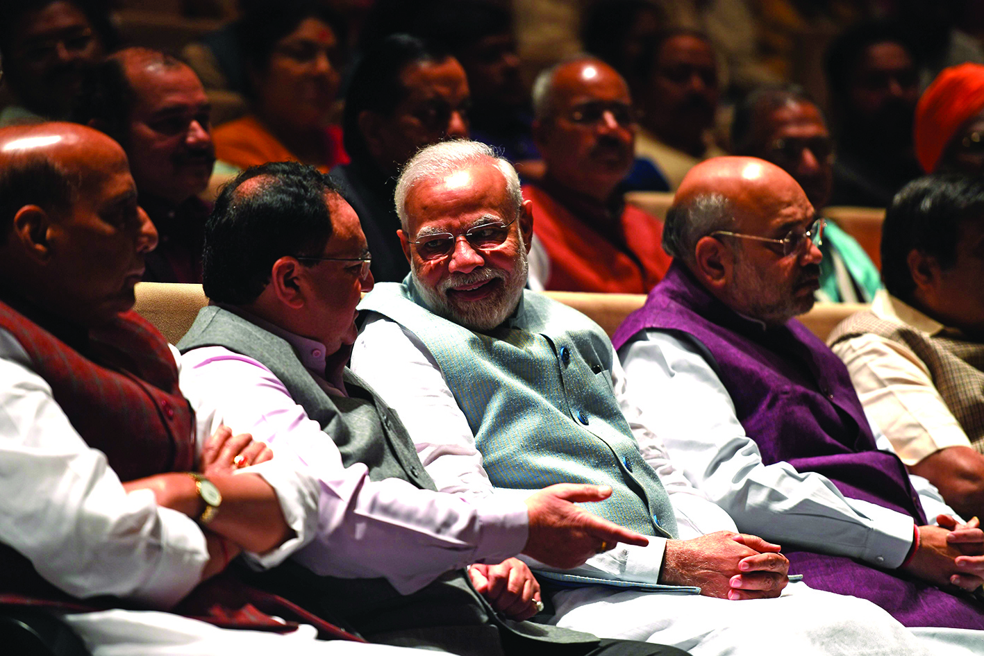 India's Prime Minister Narendra Modi (C) talks with Bharatiya Janata Party (BJP)†National President Jagat Prakash Nadda†(2L) as Home Minister Amit Shah (R) and Defence Minister Rajnath Singh (L) look on during a Bharatiya Janata Party (BJP) parliamentary committee meeting at the Parliament House in New Delhi on March 3, 2020. (Photo by Prakash SINGH / AFP)