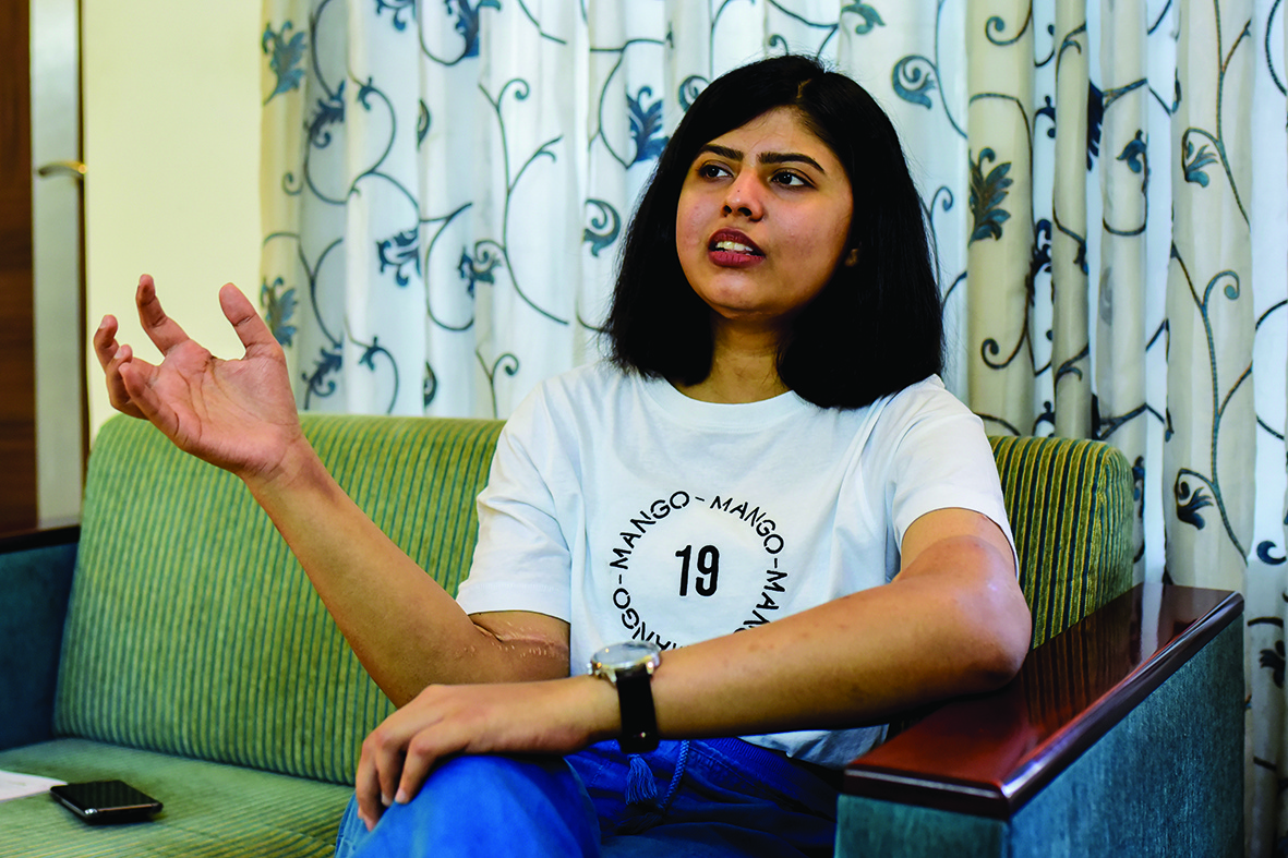 In this photo taken on March 7, 2020, Shreya Siddanagowder gestures as she talks during an interview with AFP at her home in Pune, more than two years after transplant surgery for both hands. - When amputee Shreya Siddanagowder was offered new hands, the Indian student didn't hesitate, even though they were big, hairy, once belonged to a man and were a different skin tone to her own. (Photo by Sanket Wankhade / AFP) / TO GO WITH India-health-amputee-science by Abhaya Srivastava