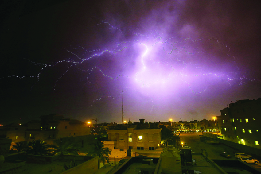Lightning flashes in the sky over Rumaithiya district in Kuwait City during a storm, on April 7, 2020. (Photo by YASSER AL-ZAYYAT / AFP)