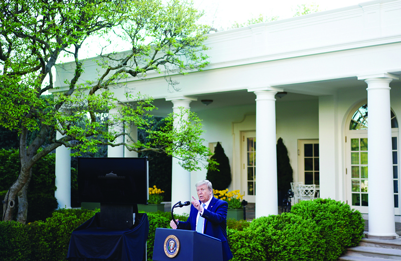 US President Donald Trump gestures as he speaks during the daily briefing on the novel coronavirus, which causes COVID-19, in the Rose Garden of the White House on April 15, 2020, in Washington, DC. (Photo by MANDEL NGAN / AFP)