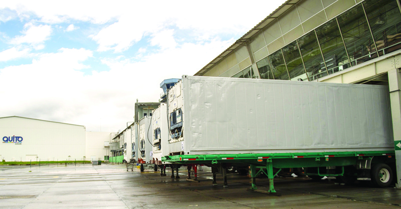 Refrigeration trucks that will serve as a temporary morgue are parked the Centro de Convenciones Bicentenario -a convention centre- where a 370-bed field hospital for COVID-19 coronavirus patients is being build in Quito on April 23, 2020. - The number of coronavirus cases in Ecuador almost doubled to 22,000 following the processing of a testing backlog, the health minister said on Thursday. (Photo by RODRIGO BUENDIA / AFP)