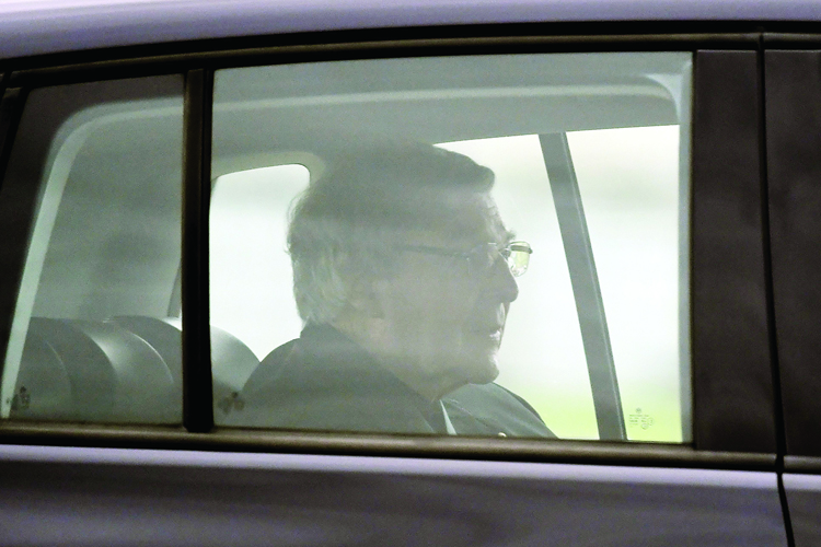 Australian Cardinal George Pell leaves after being released from Barwon Prison near Anakie, some 70 kilometres west of Melbourne, on April 7, 2020. - Cardinal George Pell's historic child sex abuse convictions were quashed by Australia's High Court on April 7, paving the way for the senior Catholic cleric's release from prison. (Photo by William WEST / AFP)
