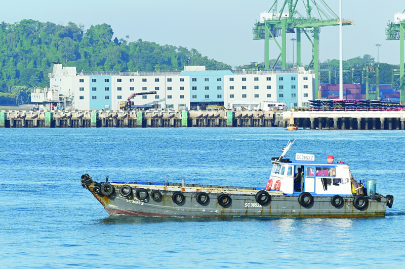 A floating accomodation facilities, which will be used as temporary housing for healthy foreign workers as a preventive measure against the spread of the COVID-19 novel coronavirus, is docked at Tanjong Pagar terminal port in Singapore on April 12, 2020. - Thousands of migrant workers are being moved out of crowded dormitories in Singapore after a surge in new coronavirus cases linked to the sites, authorities said on April 9. (Photo by Roslan RAHMAN / AFP)