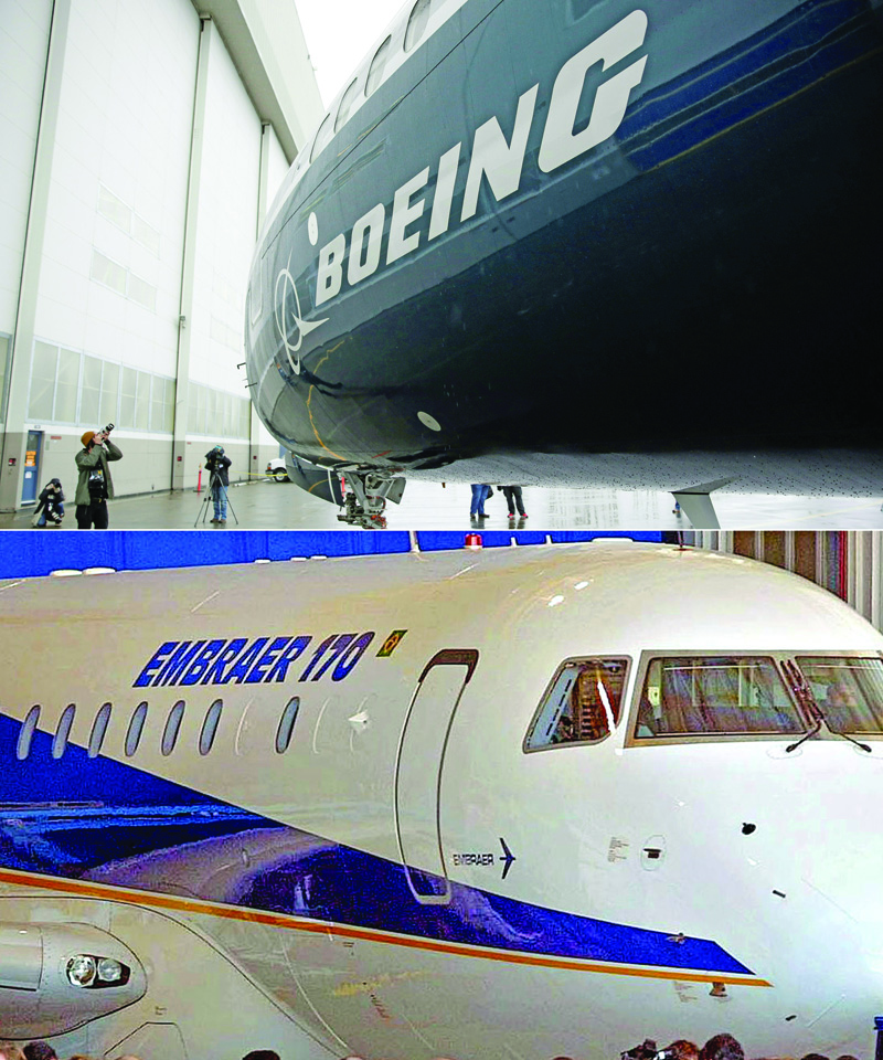 (FILES) This combination of file pictures created on July 05, 2018 shows the first Boeing 737 MAX 9 airplane (top) at the Boeing factory in Renton, Washington, on March 7, 2017; and Embraer's new passenger jet, the ERJ 170 during a ceremony at the company's manufacturing plant in Sao Jose de los Campos, Brazil, 29 October, 2001. - Boeing announced on April 25, 2020, it was pulling out of a $4.2 billion deal to acquire the commercial plane division of its Brazilian rival Embraer. The companies had planned to form a joint venture in which Boeing would take an 80 percent stake in that division. The deal had been due to be finalized no later than April 24. (Photos by Jason Redmond and MAURICIO LIMA / AFP)