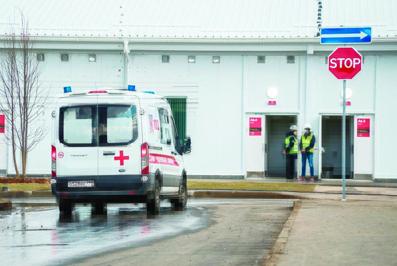 An ambulance is seen on the territory of a nearly-finished hospital for coronavirus patients outside the village of Golokhvastovo, some 60 kilometres southwest from the center of Moscow, on April 20, 2020. (Photo by Andrey BORODULIN / AFP)