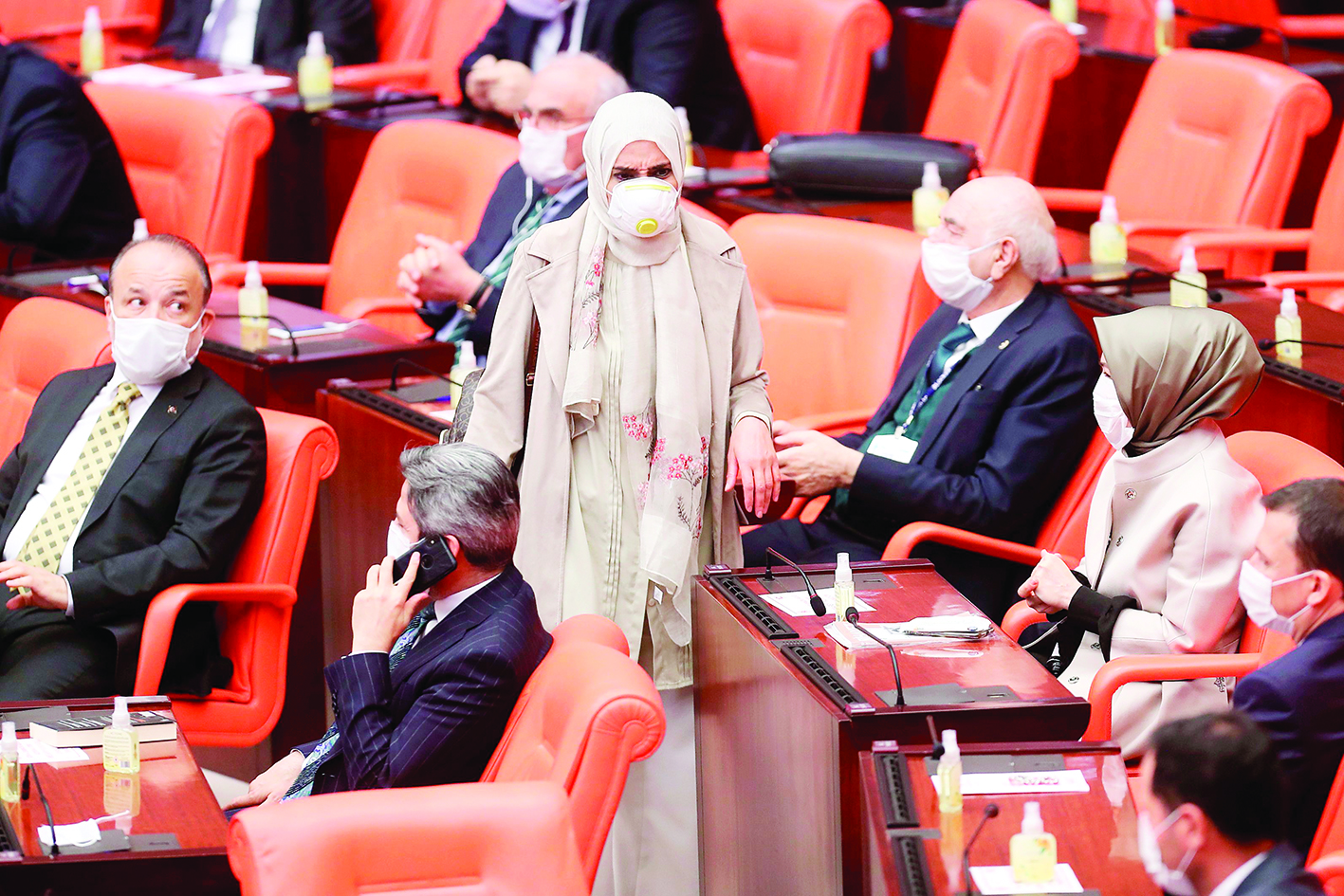 Members of Parliament wearing face masks as a precaution against the novel coronavirus (COVID-19) attend the general assembly meeting of the Grand National Assembly of Turkey (TBMM) in Ankara, Turkey on April 7, 2020. (Photo by Adem ALTAN / AFP)