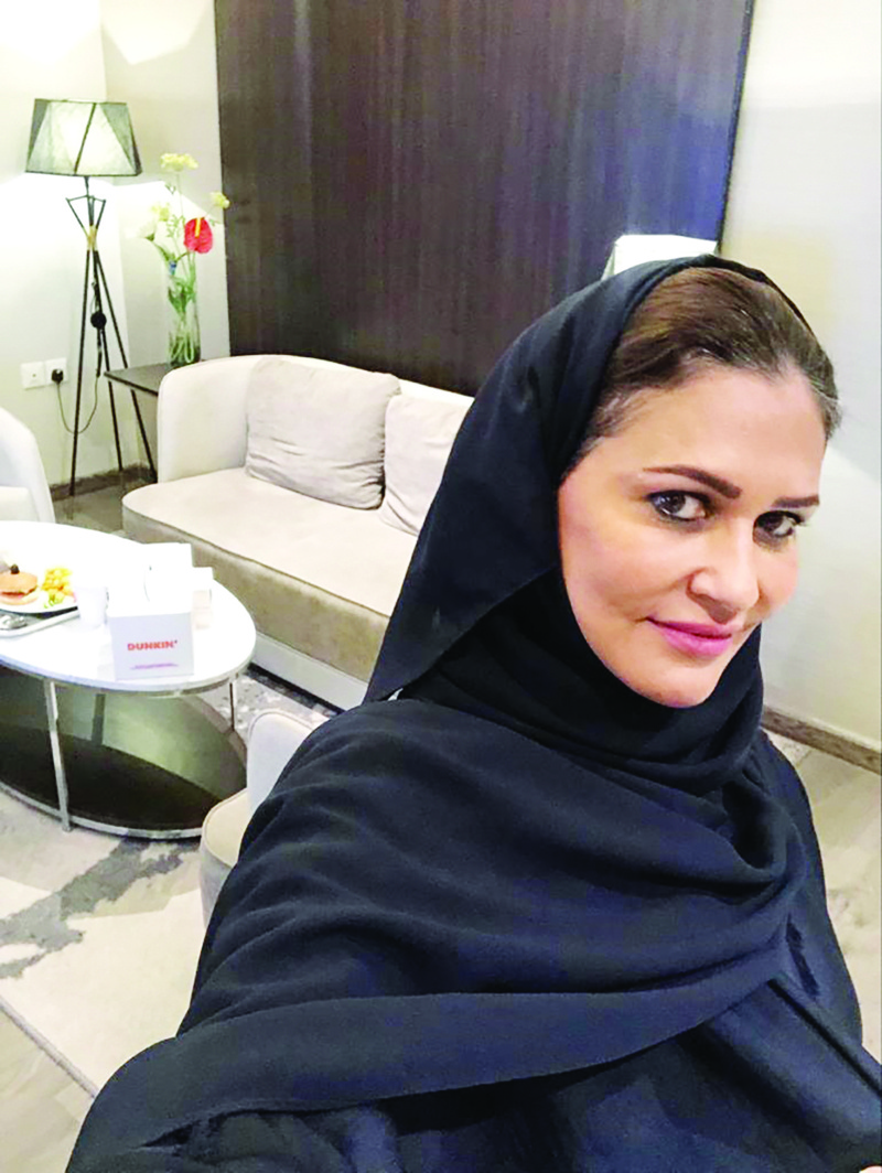 A handout picture provided by Saudi writer and journalist Taghreed al-Tassan on April 1, 2020 shows her taking a selfie at a hotel in Riyadh where she has been quarantined after testing positive for coronavirus. - Saudi Arabia has quarantined thousands of people in hotels, some in luxury suites, to combat COVID-19, throwing a temporary lifeline to an industry struggling just months after tourist visas were launched. Faced with nearly 4,500 novel coronavirus infections -- the highest in the Gulf -- the petro-state has halted air travel, locked down cities and imposed nationwide curfews in a crisis that has dealt a blow to the nascent tourism sector. (Photo by - / Taghreed Al-Tassan / AFP)