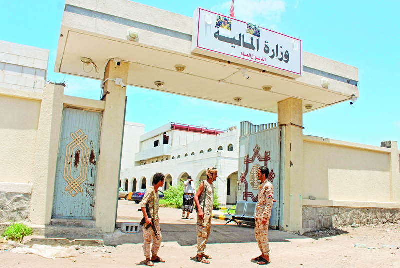Fighters with Yemen's separatist Southern Transitional Council (STC) stand guard at the entrance of the Ministry of Finance's premises in the southern city of Aden, on April 26, 2020, after the council declared self-rule in the south. - The declaration comes as a peace deal with the government crumbled, complicating a long and separate conflict with Huthi rebels who control much of the north. (Photo by Saleh Al-OBEIDI / AFP)