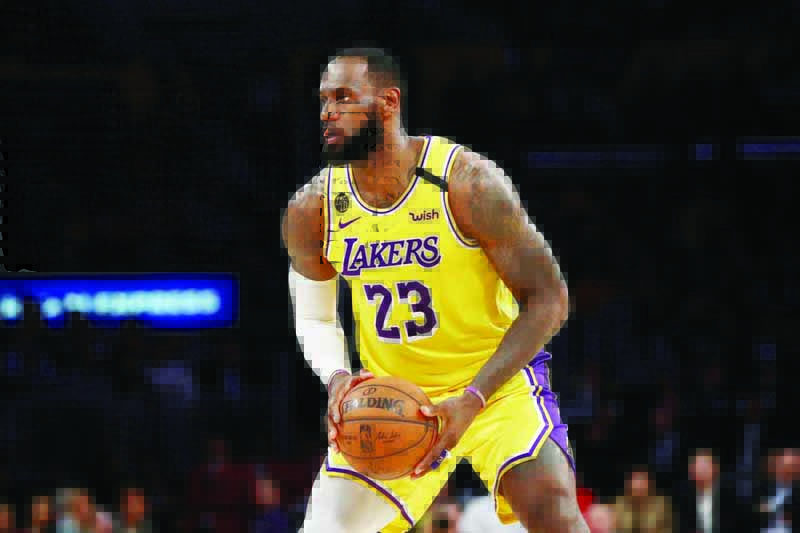 (FILES) In this file photo taken on March 5, 2020 LeBron James #23 of the Los Angeles Lakers handles the ball in a game against the Philadelphia 76ers during the second half at Staples Center on March 3, 2020 in Los Angeles, California. - LeBron James said April 8, 2020, the abrupt shutdown of the NBA season due to the worldwide coronavirus pandemic has left the Los Angeles Lakers feeling like they still have something to prove.  The Lakers were in the midst of a revival season, having made the playoffs for the first time in seven years, when the league suspended the 2019-20 season on March 11 after Rudy Gobert tested positive for COVID-19. (Photo by Kateyln MULCAHY / GETTY IMAGES NORTH AMERICA / AFP)