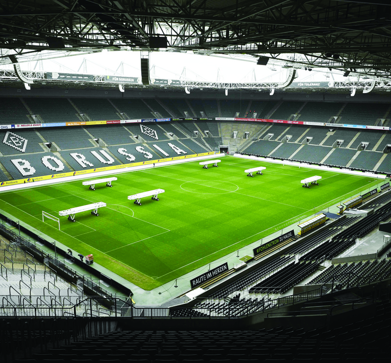 (FILES) This file photo taken on March 10, 2020 shows the empty Borussia-Park football stadium in Mˆnchengladbach, western Germany, amid the new coronavirus / COVID-19 pandemic. - Football fans and concert-goers could be barred from seeing their favourite teams and bands play live in Germany for 18 months due to the corokpnavirus, according to a science expert on April 13, 2020. (Photo by Ina FASSBENDER / AFP)