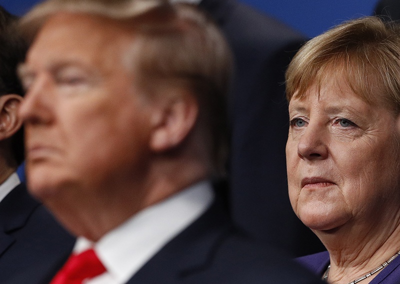 (FILES) In this file photo taken on December 04, 2019 German Chancellor Angela Merkel (R) poses with NATO leaders including US President Donald Trump (L) for the family photo at the NATO summit at the Grove hotel in Watford, northeast of London on December 4, 2019. - German Chancellor Angela Merkel will not attend an in-person summit of G7 leaders that US President Donald Trump has suggested he will host despite concerns over the coronavirus pandemic, according with German government spokesman. (Photo by PETER NICHOLLS / various sources / AFP)