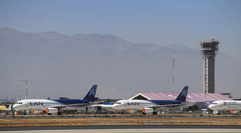 SANTIAGO: In this file photo, aircraft of Latam airline sit on the tarmac at Santiago International Airport, in Santiago, during the new coronavirus, COVID-19, pandemic. Latin America's biggest airline, the Brazilian-Chilean group LATAM, filed for bankruptcy in the US.—AFP