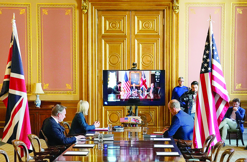 LONDON: A handout image released by 10 Downing Street, shows Britain’s International Trade Secretary Liz Truss (second left) during a video conference call with US trade representative Robert Lighthizer during UK-US trade talks, in the Foreign Office in London. — AFP