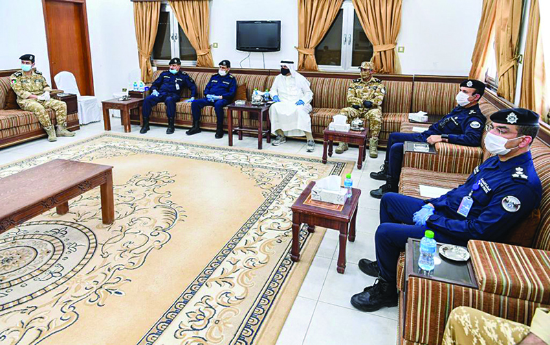 Deputy Premier and Interior Minister Anas Al-Saleh meets with Interior Ministry personnel during his visit to Al-Retqa station.