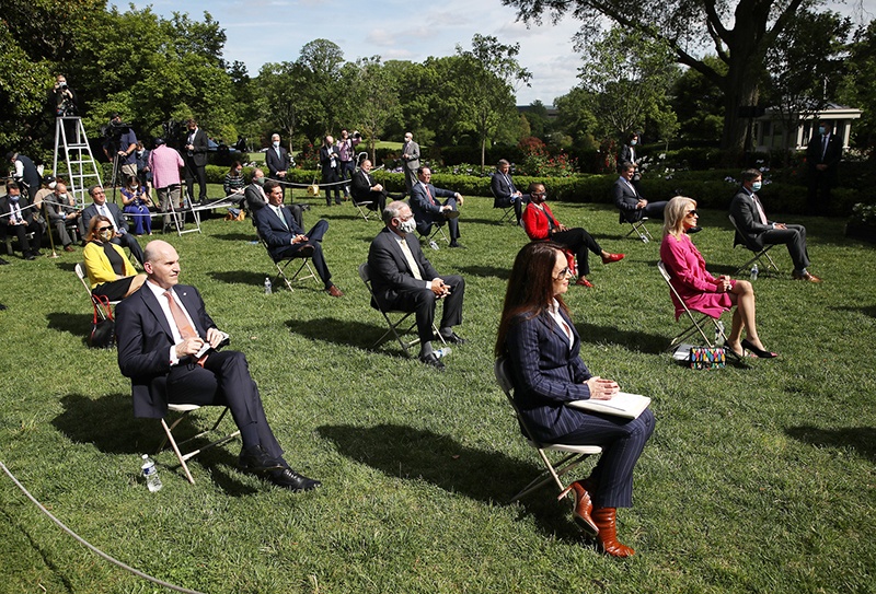 WASHINGTON: Invited guests listen as US President Donald Trump speaks during an event in the Rose Garden at the White House on May 26, 2020 in Washington, DC. – AFP