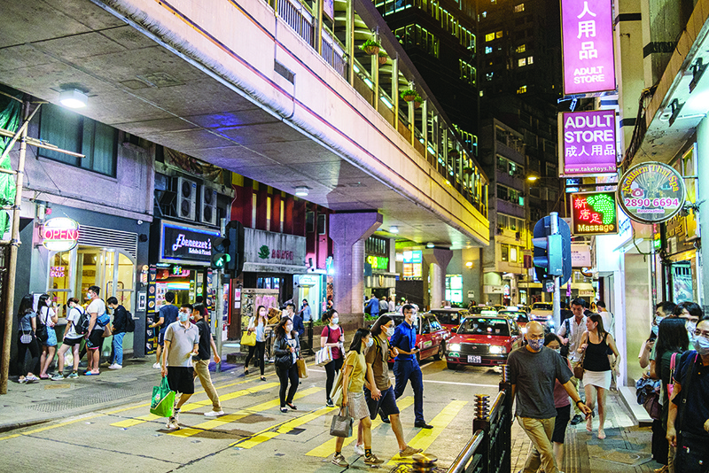 HONG KONG: Pedestrians cross a road in Hong Kong. The United States and Britain have defied China’s anger by raising Hong Kong’s autonomy at the UN Security Council as President Donald Trump prepared new measures against Beijing. — AFP
