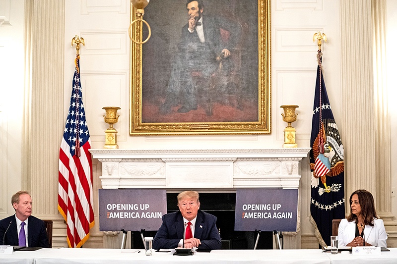 WASHINGTON, DC: US President Donald Trump speaks during a meeting with industry executives on the reopening of the US economy in the State Dining Room on Friday in Washington, DC. — AFP