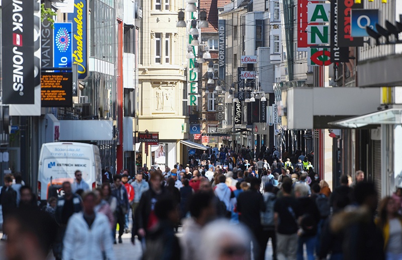 DORTMUND: People walk past shops on a pedestrian street in Dortmund in Dortmund, western Germany during the novel coronavirus COVID-19 pandemic. – AFP