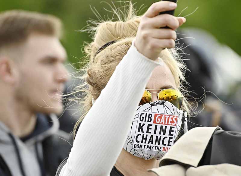 BERLIN: A protester wears a face mask reading ‘Give Gates (referring to Bill Gates) no Chance’ as she attends a protest against restrictions implemented in order to limit the spread of the novel coronavirus near the Chancellery in Berlin. -AFP