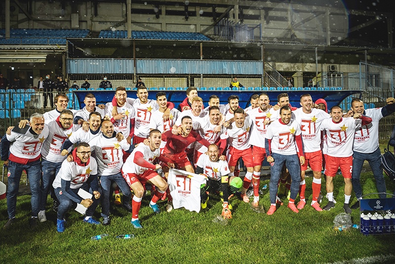 BELGRADE: Red Star Belgrade players celebrate their third successive and record-extending 31st league title after the football match between FC Rad and FC Crvena Zvezda (FC Red Star) at the “King Petar I” stadium in Belgrade on May 29, 2020, as Serbia’s first and second division resumed today behind closed doors, after it was stopped due to the COVID-19 pandemic in mid-March. — AFP
