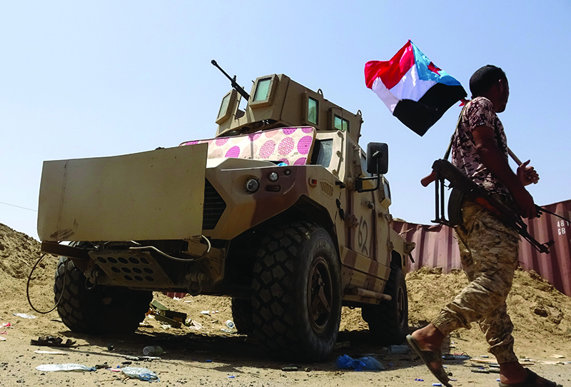 ABYAN, Yemen: A fighter loyal to Yemen's separatist Southern Transitional Council (STC) holds the separatist flag in this southern province on May 18, 2020. – AFP