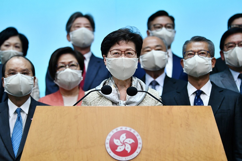 HONG KONG: Hong Kong Chief Executive Carrie Lam (center) holds a press conference after attending the opening session of the National People’s Congress (NPC) at the Great Hall of the People in Beijing. —AFP
