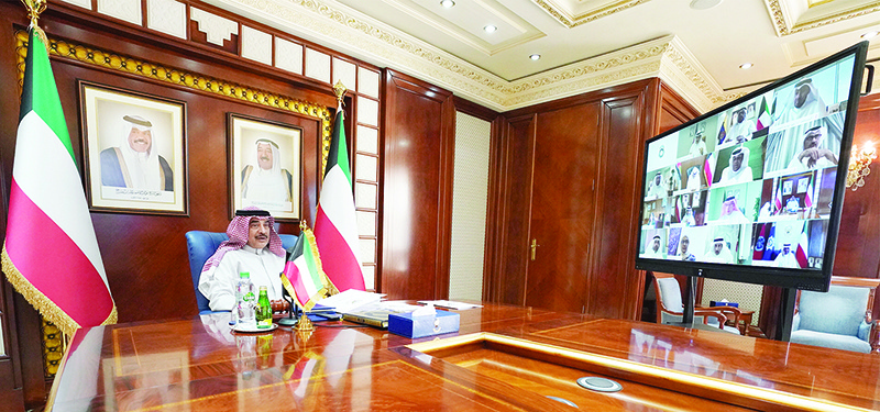 KUWAIT: His Highness the Prime Minister Sheikh Sabah Al-Khaled Al-Hamad Al-Sabah chairs the cabinet's weekly meeting via video conference on Monday. -- KUNA photos
