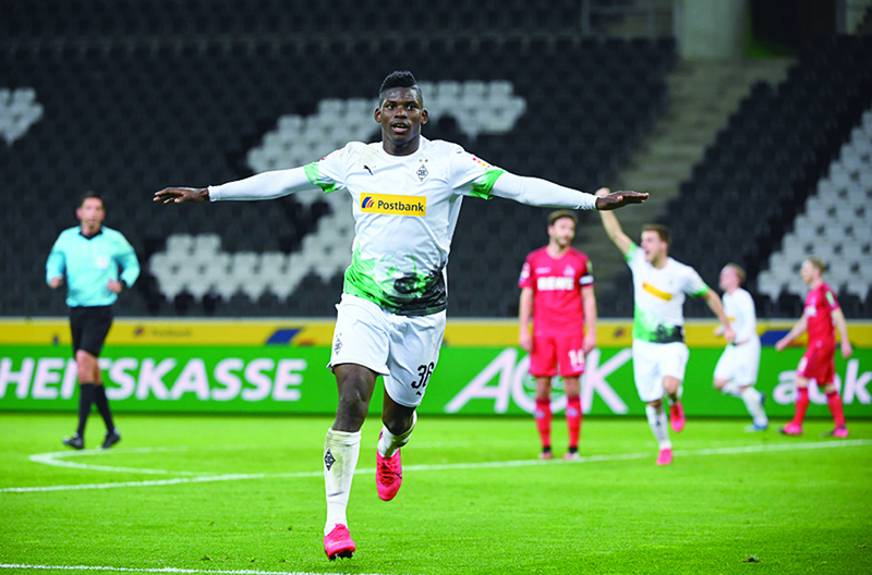 BERLIN: File photo taken on March 11, 2020 shows Moenchengladbach's Swiss forward Breel Embolo celebrates scoring the opening goal during the German first division Bundesliga football match. The Bundesliga resumes with strict sanitary rules for players and spectators that could inspire other countries amid the pandemic of the novel coronavirus (COVID-19). – AFP