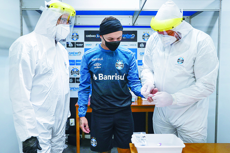 PORTO ALEGRE: Handout picture released by Brazil’s Gremio football club player Everton Soares (Cebolinha) undergoing tests before a training session at Arena do Gremio in Porto Alegre, Brazil on May 6, 2020. Brazilian President Jair Bolsonaro has urged football clubs to begin league competition as soon as possible. —AFP