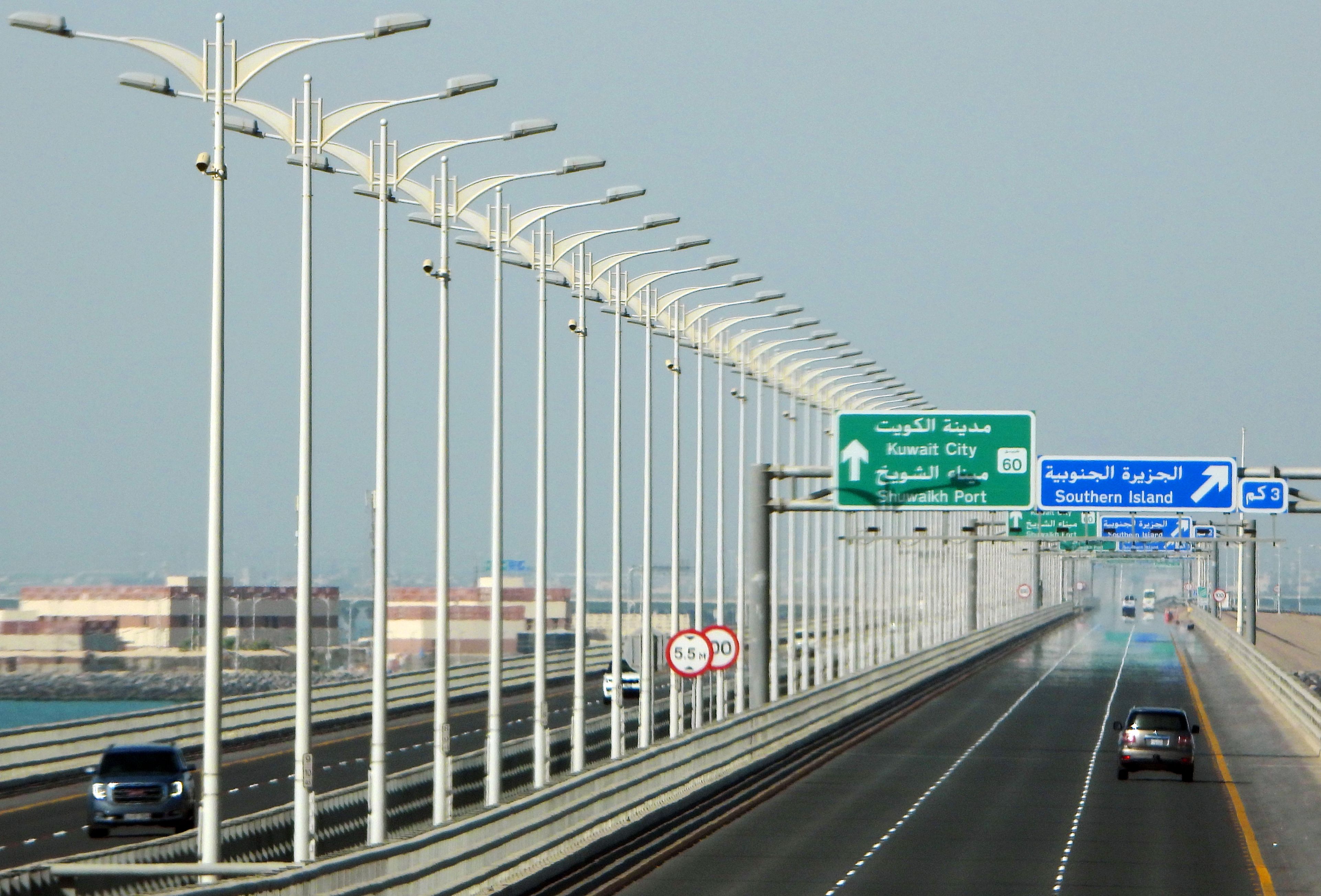 This picture taken  on June 21, 2020, shows a partial view of the Sheikh Jaber Causeway in Kuwait City. - The causeway project, which includes two paths over the Kuwait Bay, is the worlds biggest maritime causeway project.nUndertaken by Kuwait Ministry of Public Works (MPW), the construction began in 2013 and was officially inaugurated in May 2019. (Photo by YASSER AL-ZAYYAT / AFP)