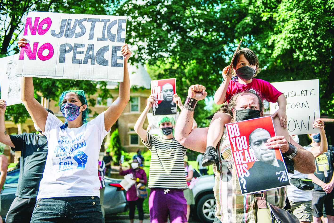 ST. PAUL, MN - JUNE 24: People chant during a demonstration on June 24, 2020 in St. Paul, Minnesota. Protestors gathered outside of Governor Tim Walzs mansion to demand a stricter reform of police legislation in the state of Minnesota. The city of St. Paul continues protests and gatherings to honor the death of George Floyd and other Black men and women who have been killed by officers of the Minnesota Police Department.   Brandon Bell/Getty Images/AFP