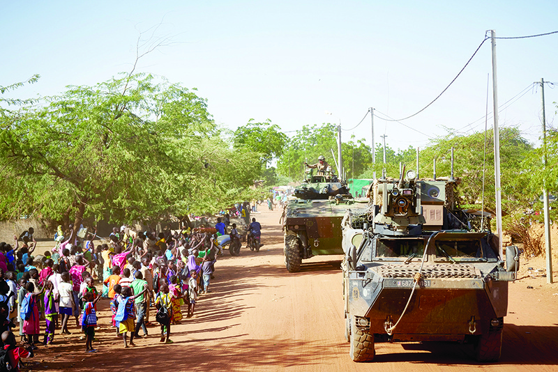 Soldiers of the French Army patrols the village Gorom Gorom in Armoured Personnel Carriers during the Barkhane operation in northern Burkina Faso. — AFP