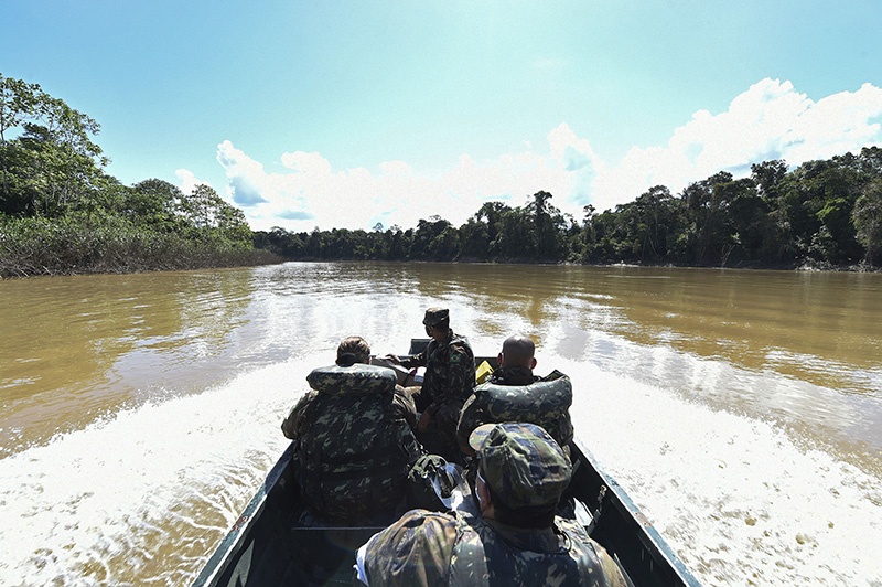 The medical team of the Brazilian Armed Forces sails on a boat along the Javari River on their way to the Cruzeirinho village, near Palmeiras do Javari, Amazonas state, northern Brazil to assist indigenous population amid the COVID-19 pandemic. — AFP