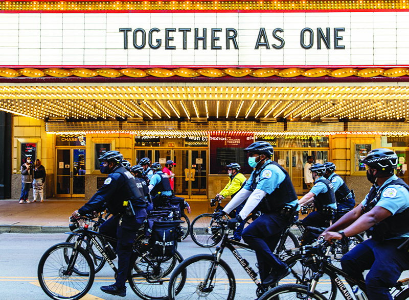 CHICAGO: Chicago police officers on bikes follow crowds during a protest on June 13, 2020 in Chicago, Illinois. Protests erupted across the nation after George Floyd died in police custody in Minneapolis, Minnesota on May 25th. —AFP