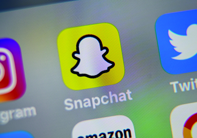 Photo shows the logo of mobile app Snapchat displayed on a tablet. —AFP