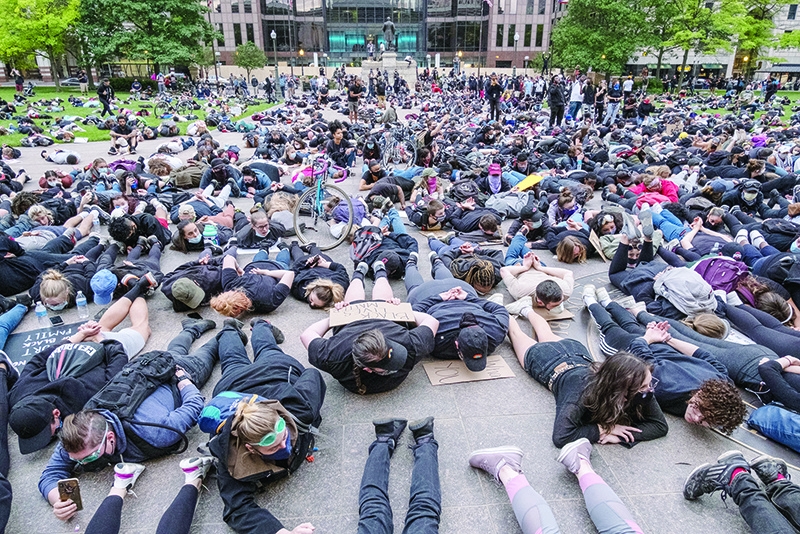 OHIO: Protesters hold a die-in as they gather peacefully to protest the death of George Floyd at the State Capital building in downtown Columbus, Ohio. — AFP