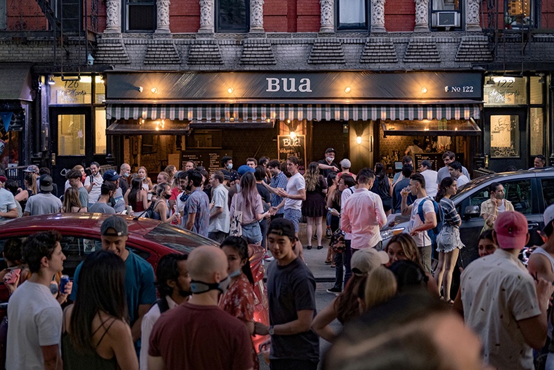NEW YORK: People gather outside a reopening phase following the COVID-19 outbreak in the East Village neighborhood in New York City, US.— Reuters