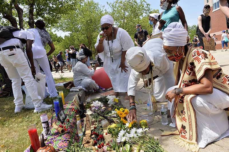 BOSTON: A healing team makes a shrine and offerings to their ancestors during a Juneteenth Protest and march in honor of Rayshard Brooks and other victims of Police Violence in Boston, Massachusetts on June 22, 2020.— AFP