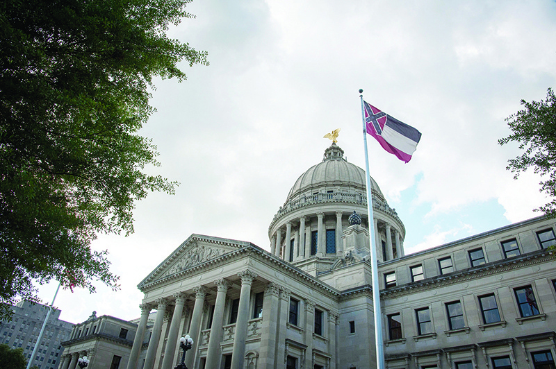 MISSISSIPPI: The Mississippi state flag flies in front of the Mississippi State Capitol building in Jackson, Mississippi. — AFP