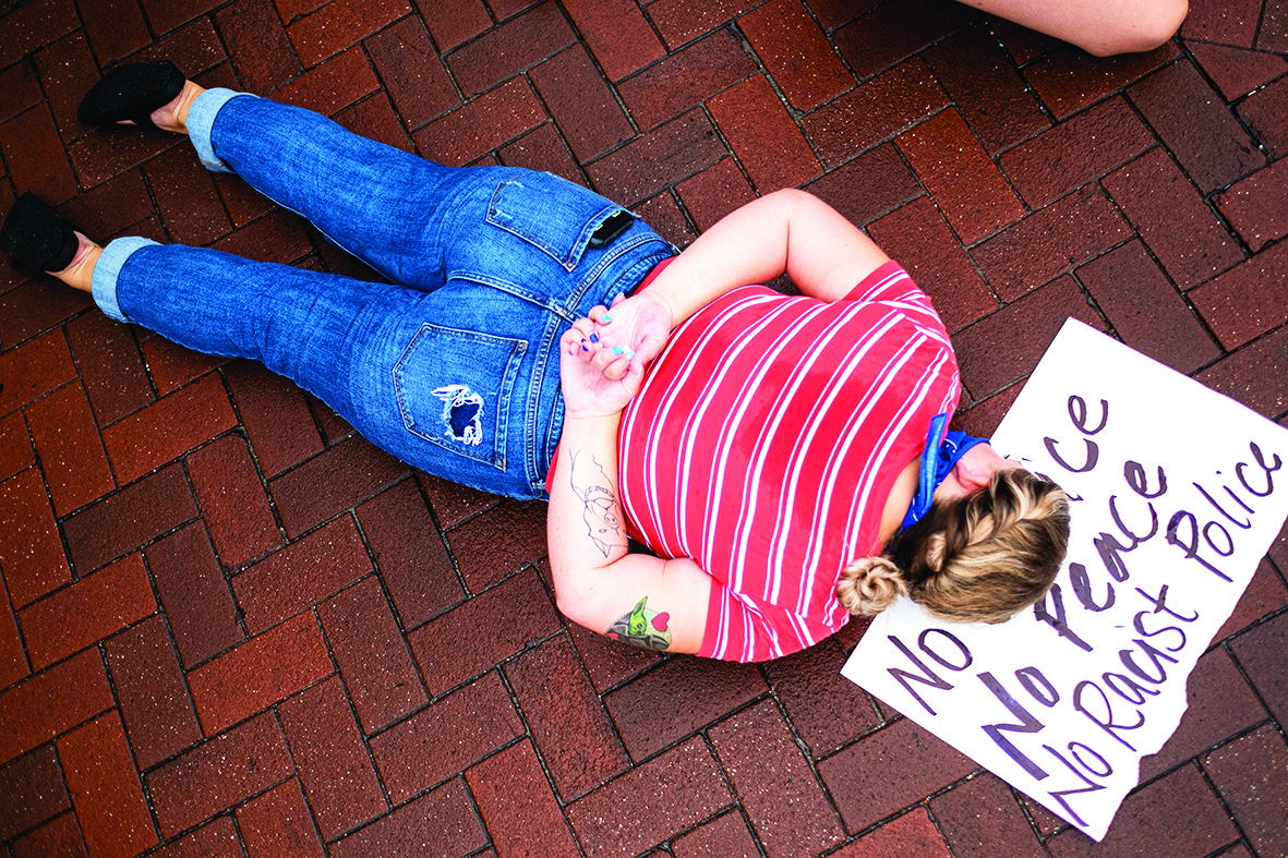 FLORIDA: A demonstrator lays on the ground during a rally in response to the recent death of George Floyd while in police custody in Minneapolis in Winter Park, Florida. – AFP