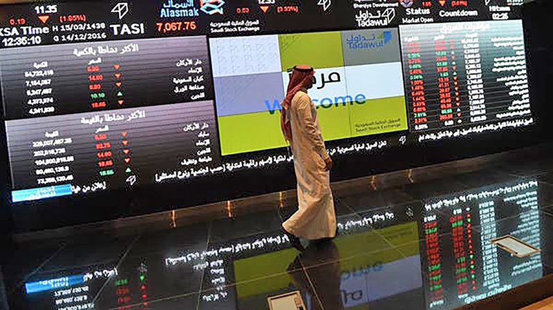RIYADH: In this file photo, a Saudi investor monitors the Saudi Stock Exchange (Tadawul).All major Gulf markets fell yesterday in line with oil and global stocks as growing fears of a second wave of coronavirus infections revived economic worries. — AFP