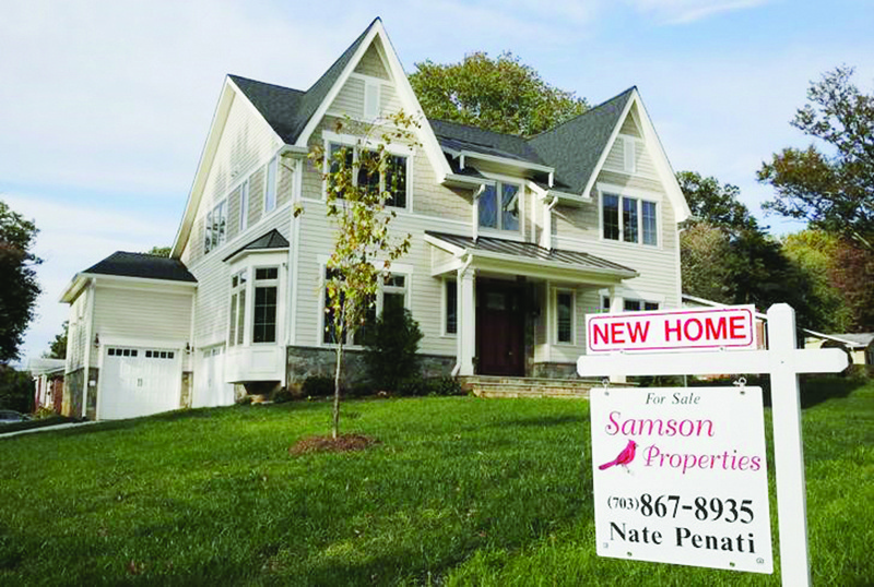 A real estate sign advertising a new home for sale is pictured in Vienna, Virginia. — Reuters