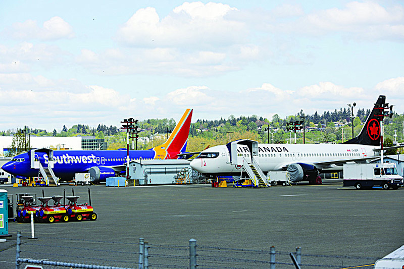 In this file photo, Boeing 737 MAX 9 airliners are pictured on the flight line at the Boeing Renton Factory in Renton, Washington. —AFP