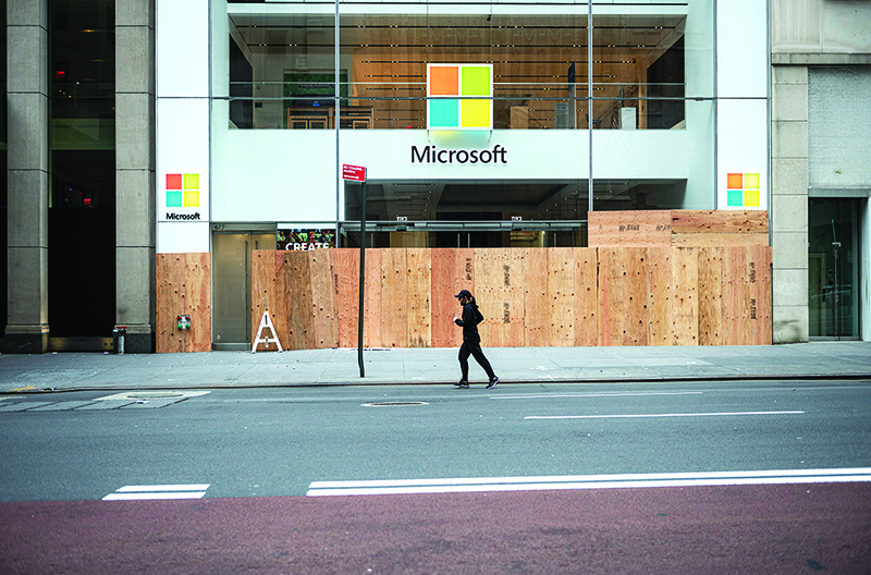 NEW YORK: A looted and boarded up Microsoft store is seen after a night of protest over the death of an African-American man George Floyd in Minneapolis in Manhattan in New York City. Microsoft said on Friday it will close its stores around the world except for four locations that will be transformed into “experience centers,” moving its retail operations online. – AFP