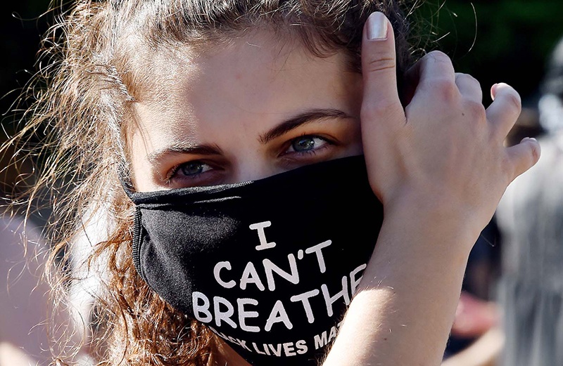 WASHINGTON: A protester wears a ‘I Can’t Breathe’ mask during a demonstration against the death of George Floyd at a park near the White House in Washington, DC. — AFP
