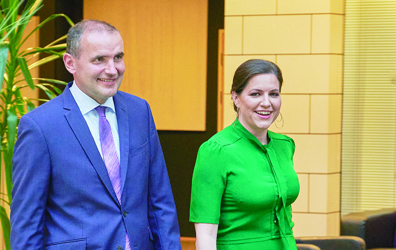 President of Iceland, Gudni Th Johannesson (L) and his wife Eliza Reid arrive to celebrate his re-election at a hotel in the Icelandic capital Reykjavik, Iceland on June 27, 2020. (Photo by Halldor KOLBEINS / AFP)