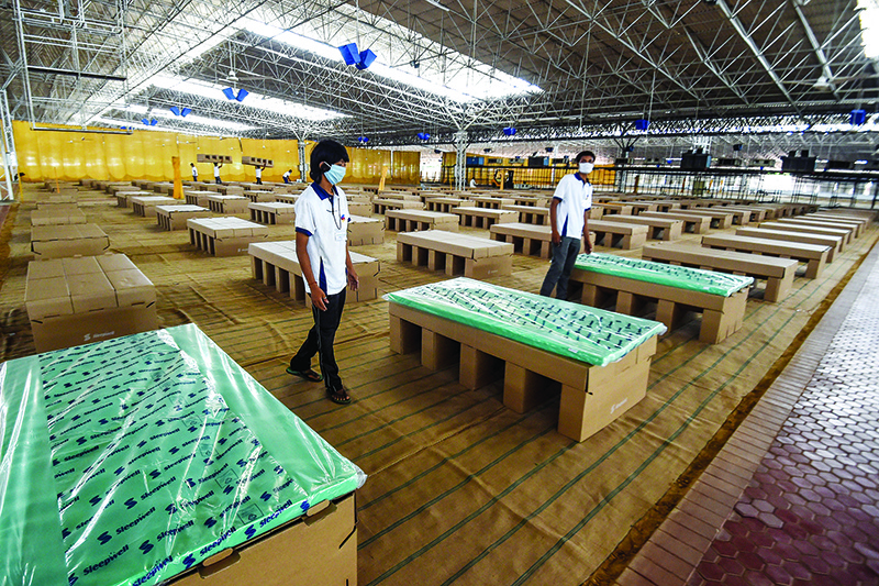 NEW DELHI: This photograph taken on June 25, 2020 shows cardboard beds installed inside the campus hall of spiritual organization Radha Soami Satsang Beas (RSSB), which is being converted into a coronavirus care center. — AFP