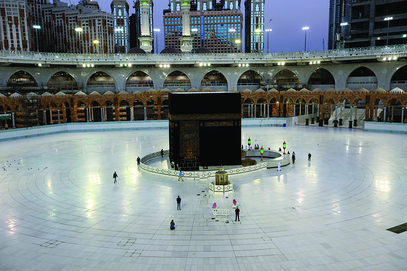 MAKKAH: A picture taken yesterday shows a few worshippers performing Fajr prayers in the Grand Mosque complex. – AFP