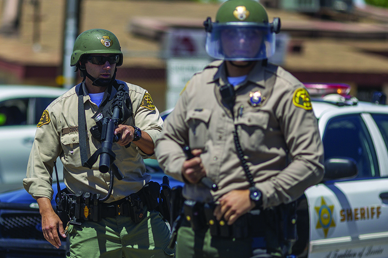 PALMDALE, California: Sheriffs block marchers from continuing down E Palmdale Boulevard after a demonstration on Saturday. — AFP