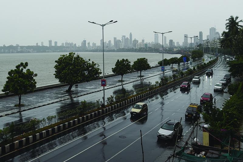MUMBAI: Commuters drive in the rain along Marine Drive as Cyclone Nisarga barrels towards India’s western coast yesterday. — AFP